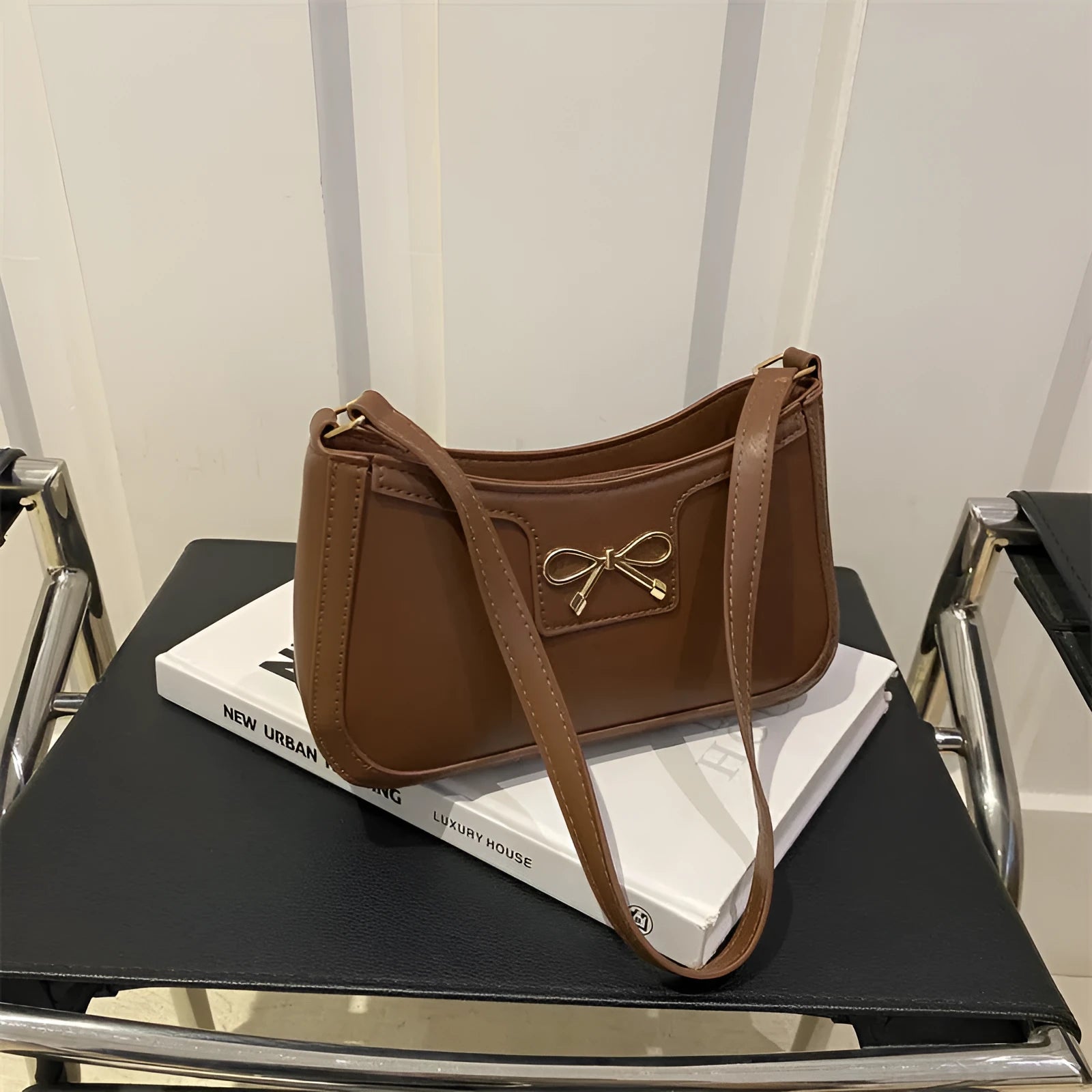 Horizontal square PU leather shoulder bag with a bow decoration, shown in multiple colours.