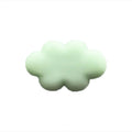 Resin cartoon car fragrance clip in light green colour, dimensions 17mm by 27mm, on a car air vent