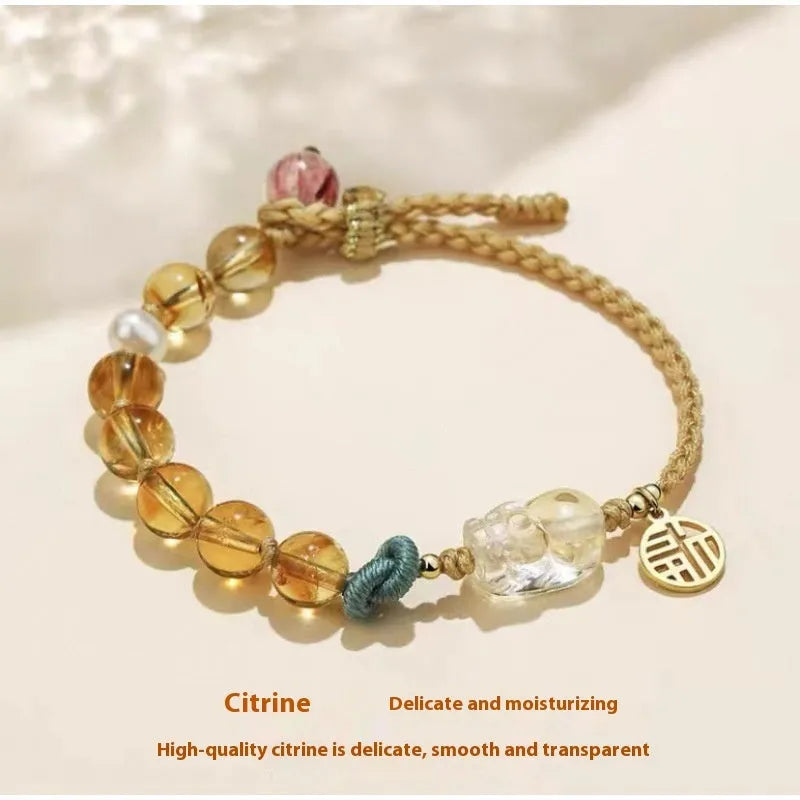 Hand-woven crystal bracelet with animal zodiac design in citrine colour