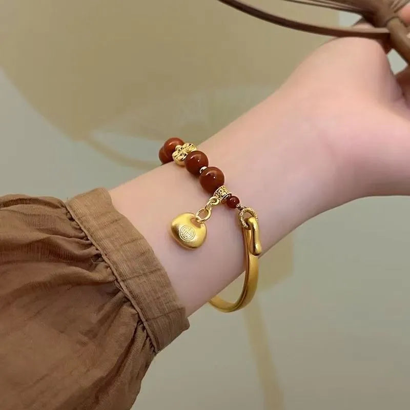 Golden Southern Red Agate character ingot bracelet with antique design on wrist