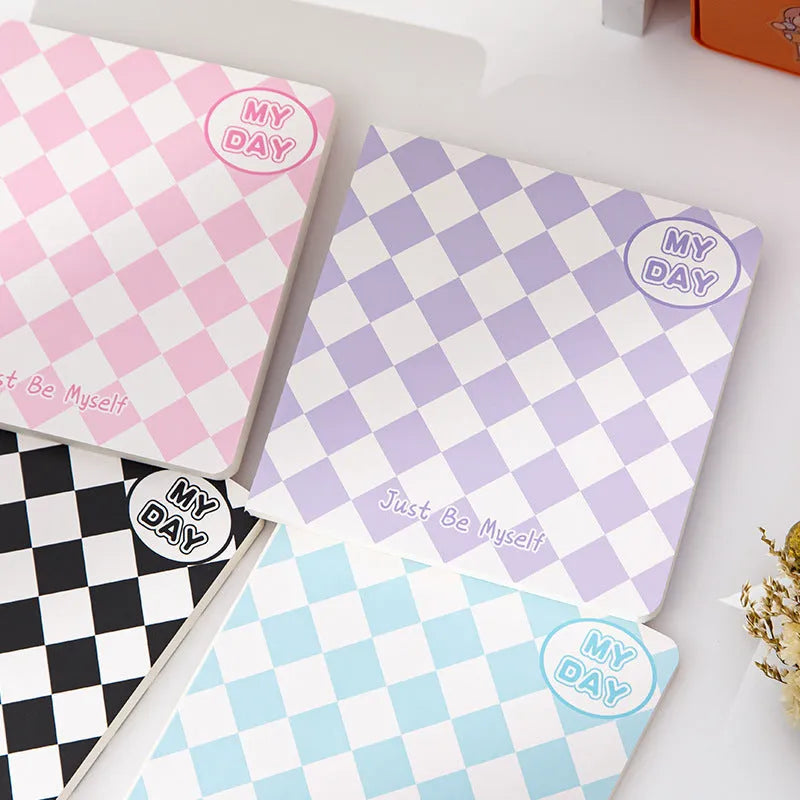 Manual ledger notebook with 100 sheets showing 12 different cover designs including checkerboard and fruit patterns