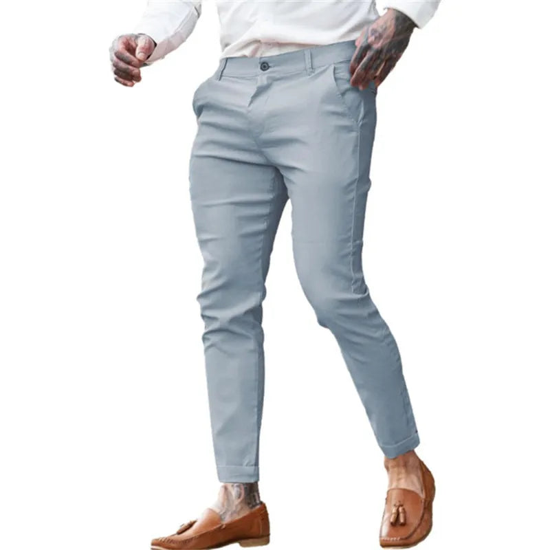Men's slim fit pencil trousers in stretch cotton twill fabric, shown in a solid colour with a zip fly and mid-waist design.