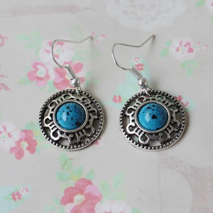 Handmade Miao silver turquoise geometric earrings with flower disk shape and totem patterns