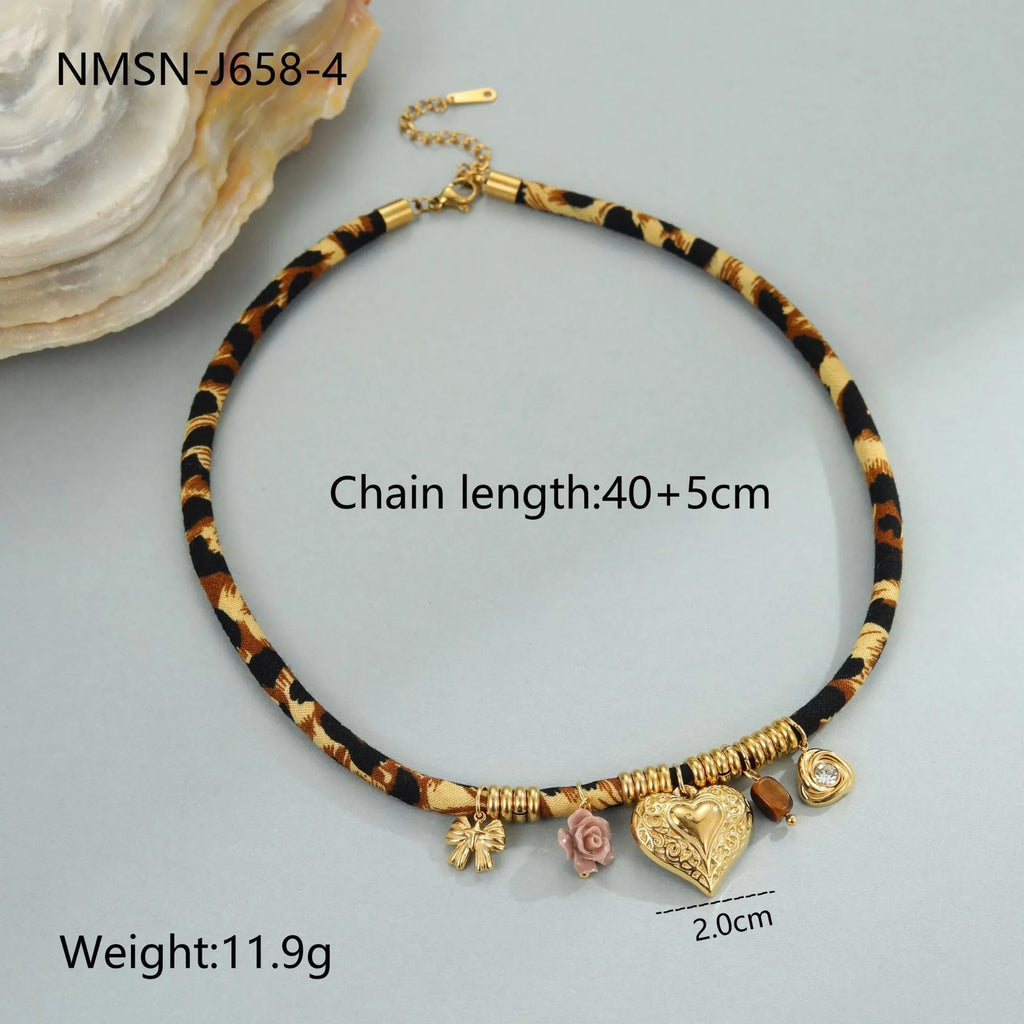 Gold geometric leopard series pendant on an adjustable stainless steel necklace chain.