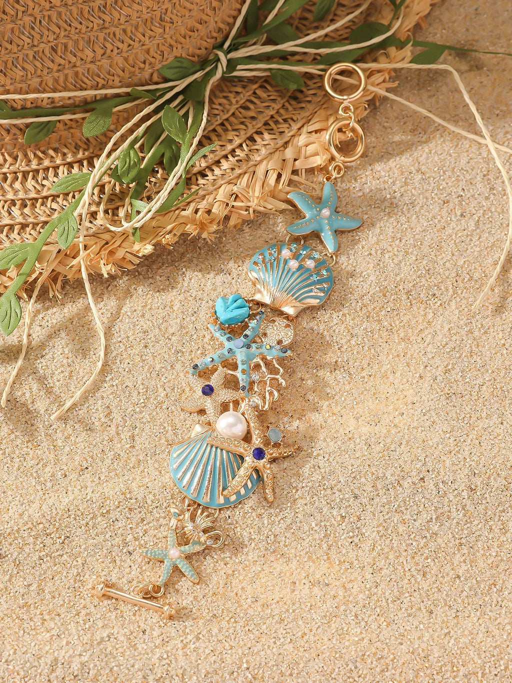 Women's alloy bracelet with starfish design in turquoise, coral red, or coral blue with marine shell and boat anchor elements