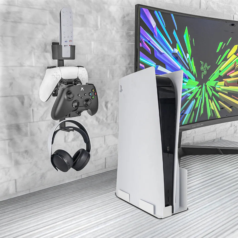 White wall-mounted storage hook holding PS5 controller and gaming headset