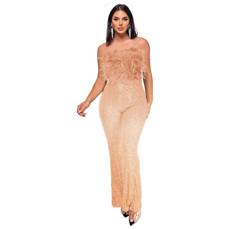 Women's black sleeveless backless jumpsuit with flared legs and sequin detailing, showing front and back views