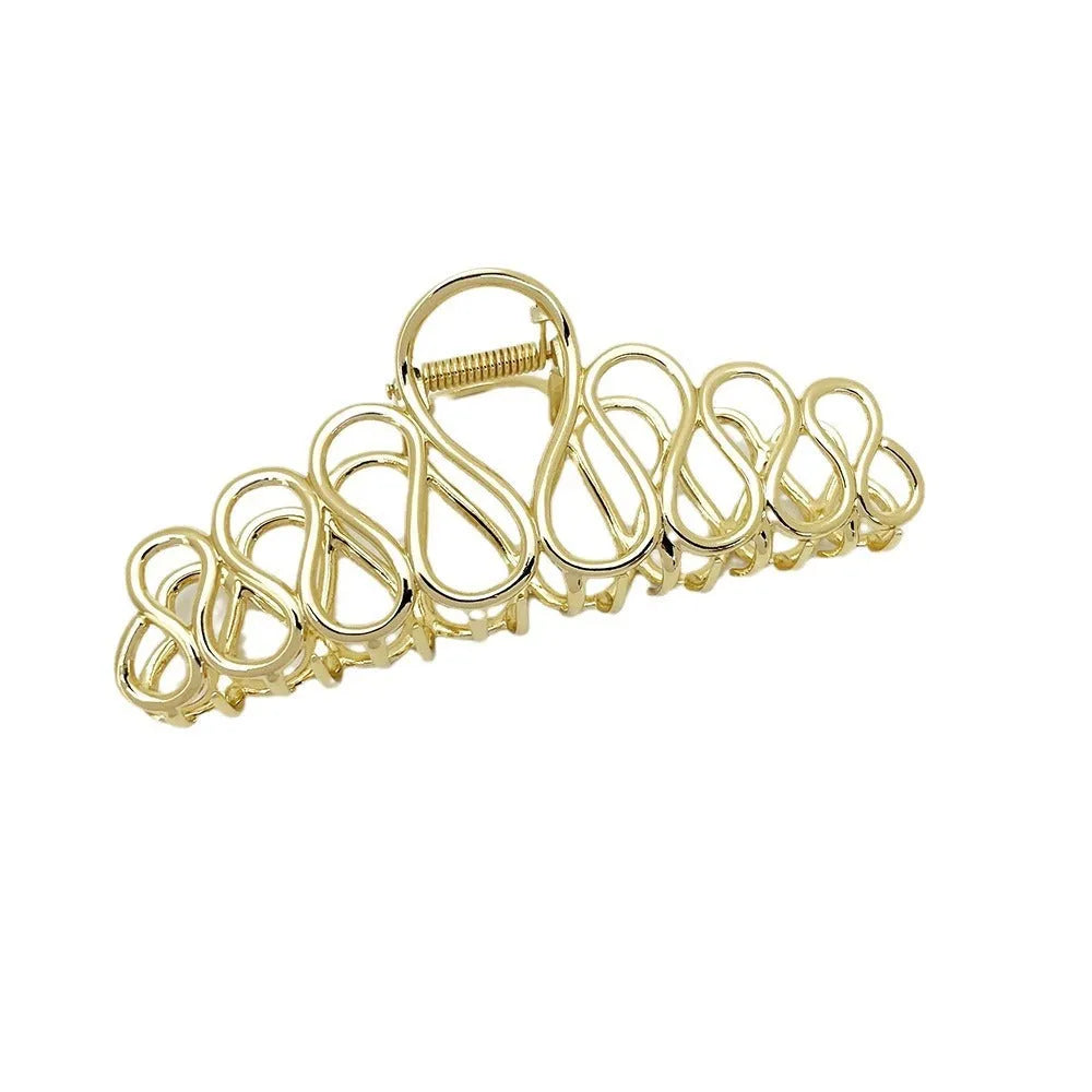 Minimalist large alloy hair clip with tassel in gold or silver for updo hairstyles.