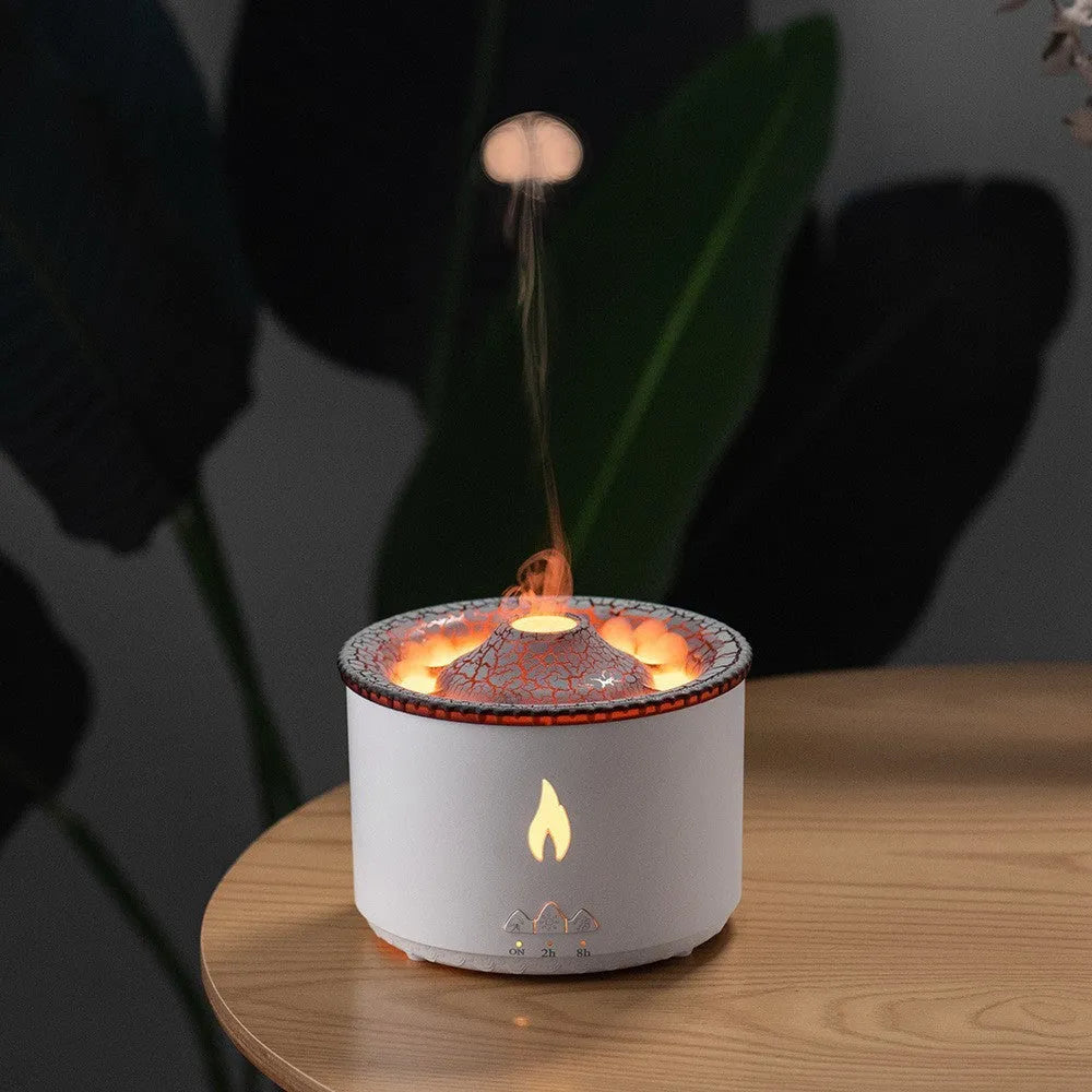 Round white volcano-shaped humidifier with water tank and single fog outlet on wooden surface