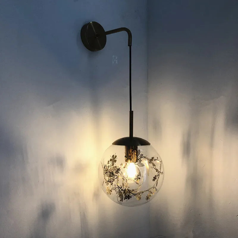 Glass bedside wall lamp with LED lighting in golden flower finish measuring 20cm diameter