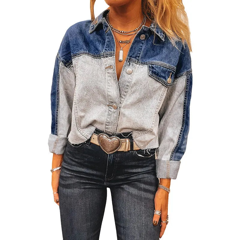 Women's loose fit denim coat with a row of silver buckle closures on the front.