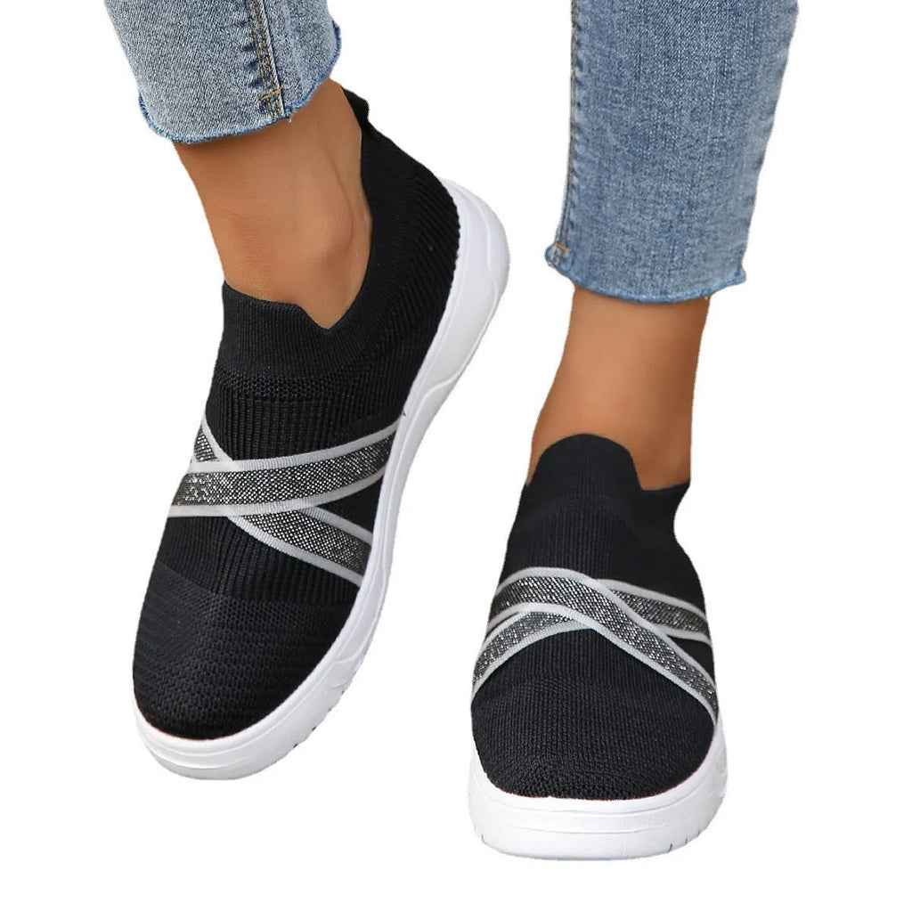 Women's black flyknit mesh casual shoes with flat rubber sole and tassel detail