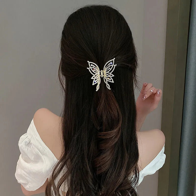 Butterfly hair barrette measuring 6.7cm x 6.2cm with electroplated alloy construction