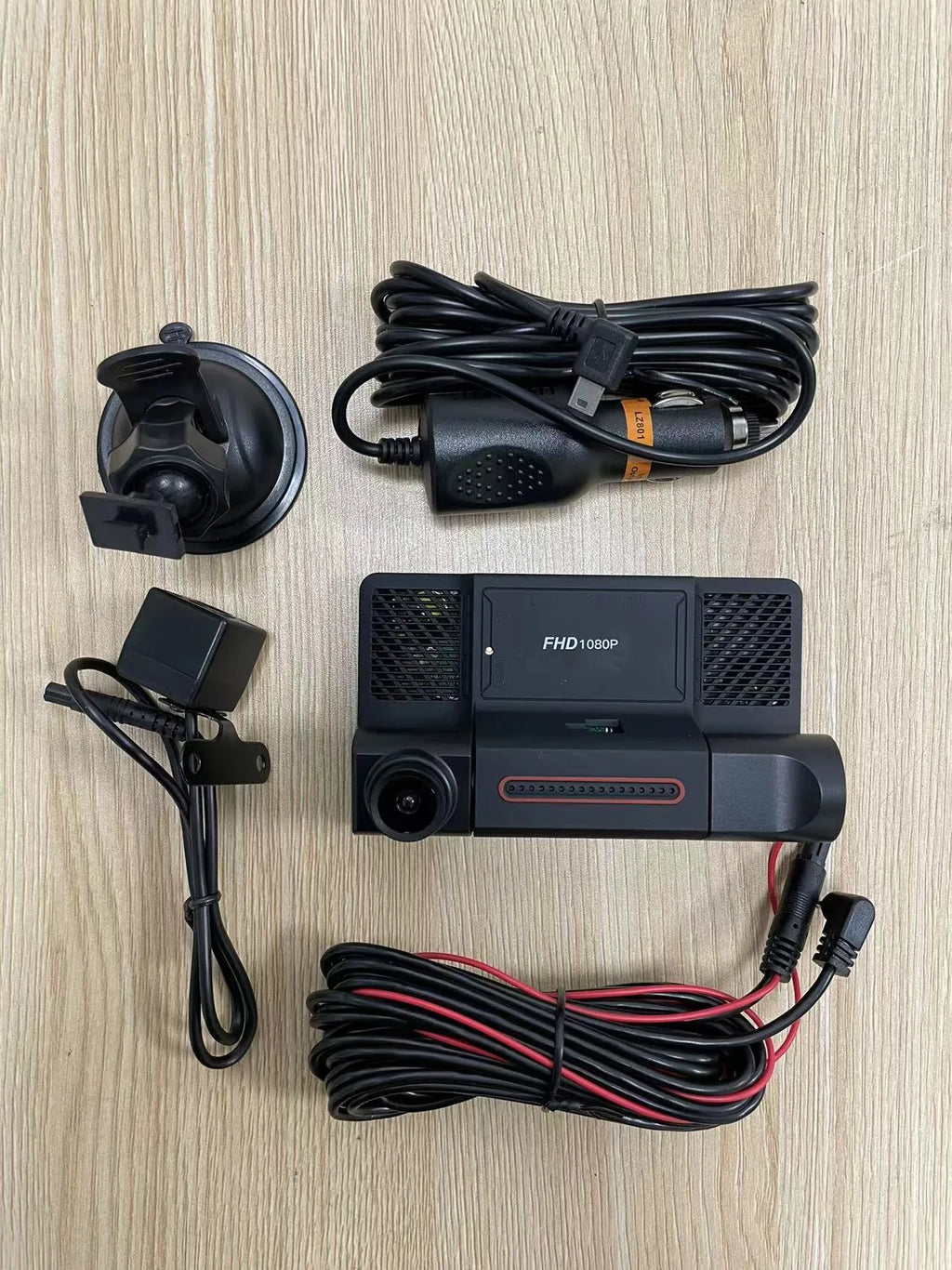 Black 4-inch touch screen car dash cam with three lenses for front, rear, and interior recording