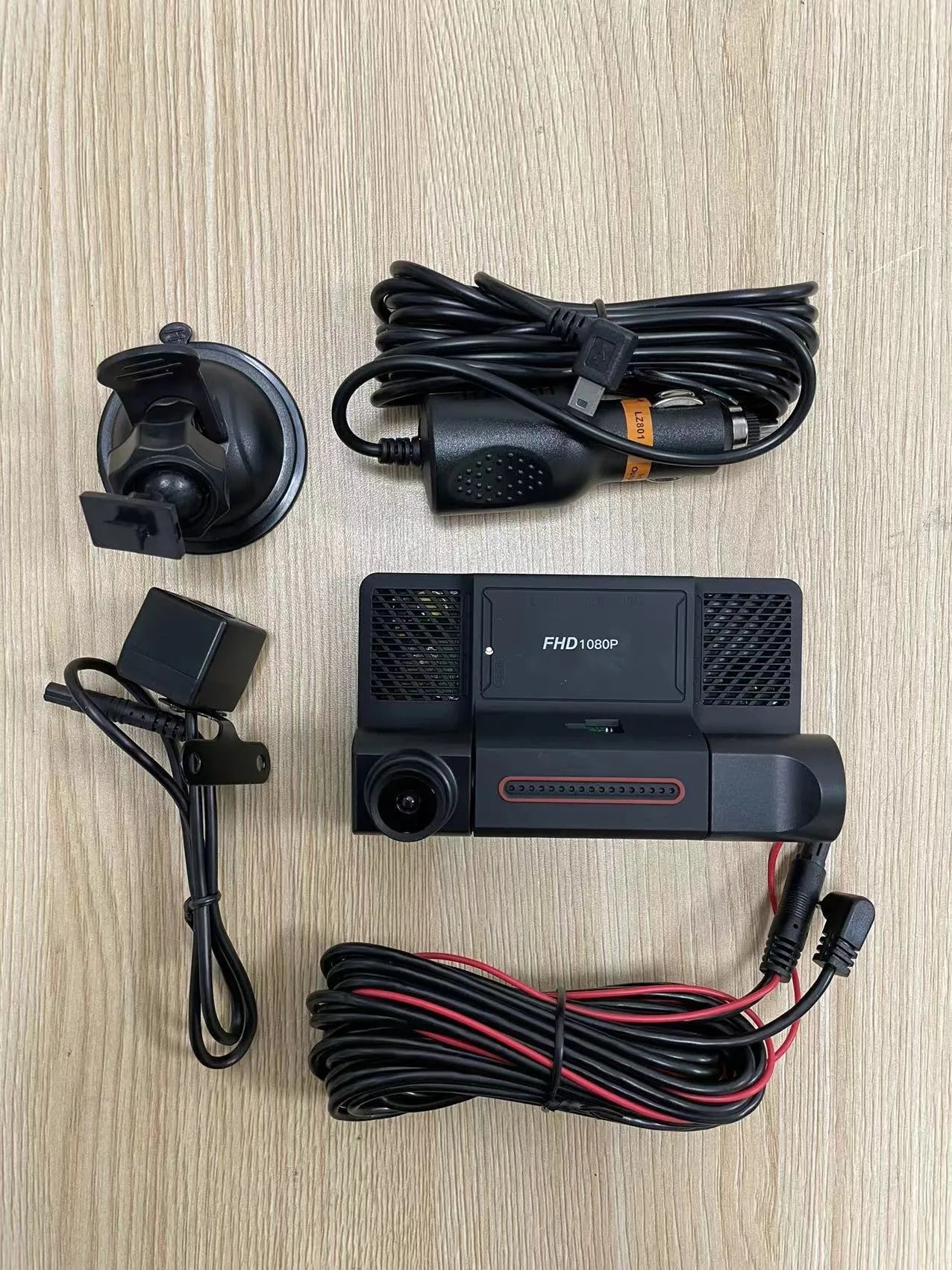 Black 4-inch touch screen car dash cam with three lenses for front, rear, and interior recording