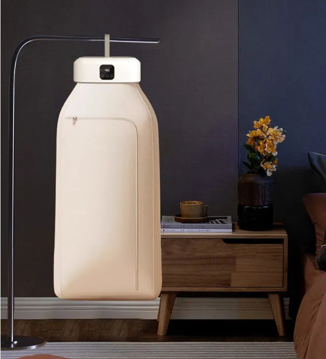 White cylindrical compact laundry dryer with remote control, dimensions 29 × 22 × 10cm, foldable for storage