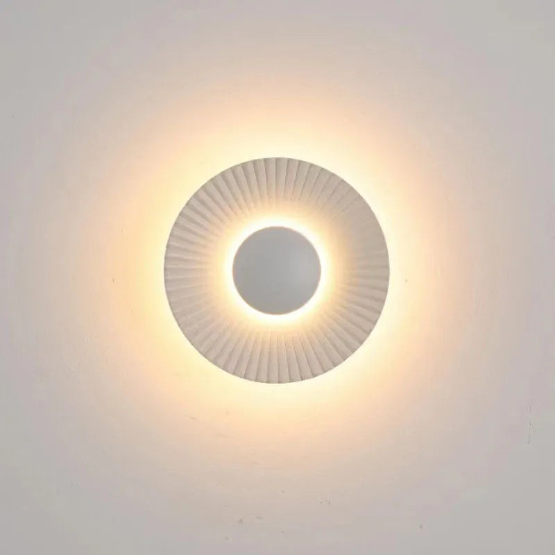 Round wall lamp with aluminium shade and LED light source for bedroom lighting