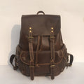 Brown men's genuine cowhide leather backpack with air pillow belt straps.