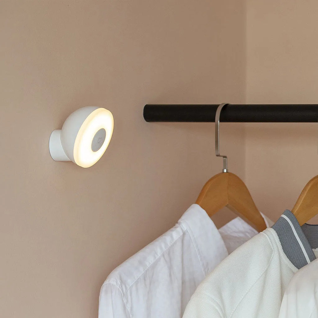 White Mijia Night Light 2 Bluetooth bedside lamp with human body induction, 94mm width, on wooden table