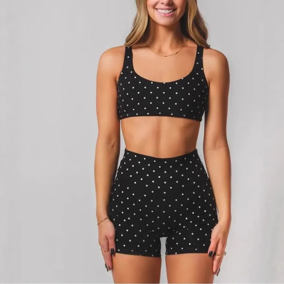 Black wave point two piece swimsuit set with sleeveless top and fifth pants, sizes XS to 2XL