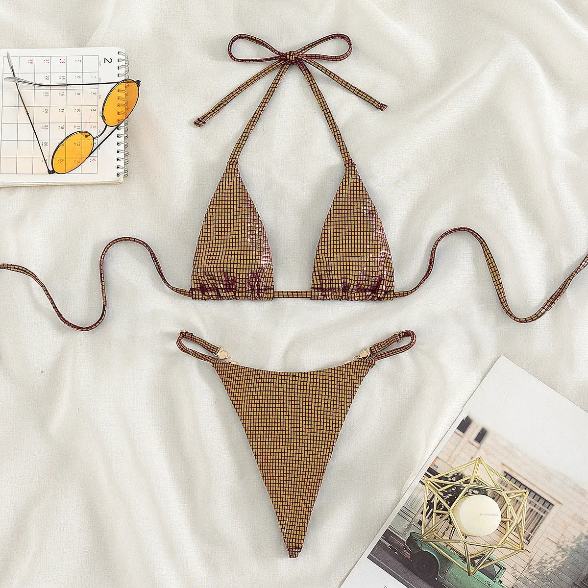 Women's solid colour blue T-back split bikini set on a mannequin.