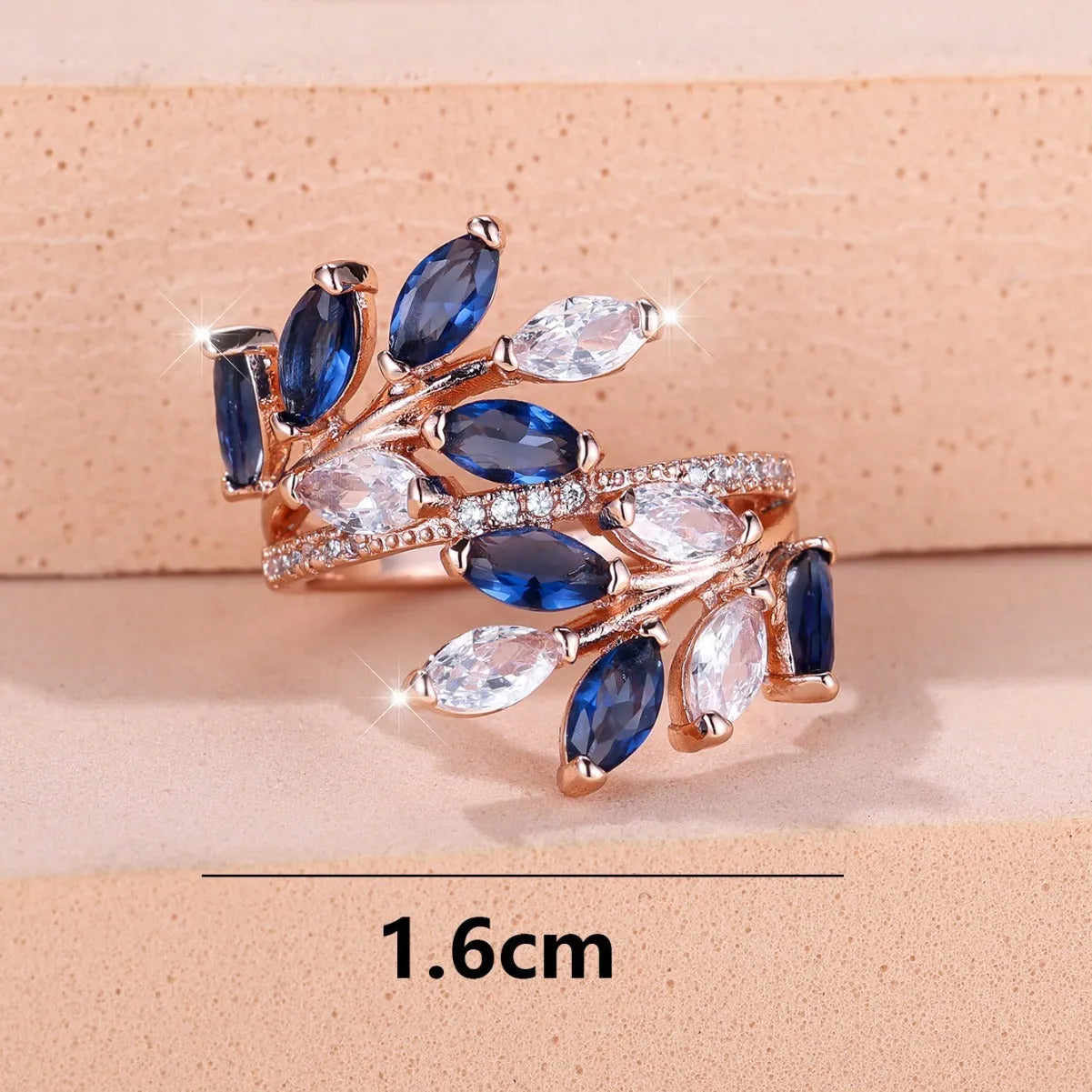 Adjustable copper leaf ring with horse eye zircon stones in multiple colour options showing botanical design