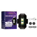 Mini driving light accessory kit showing compact 1.3x3.9cm light, USB cable, rubber bands, and round stickers