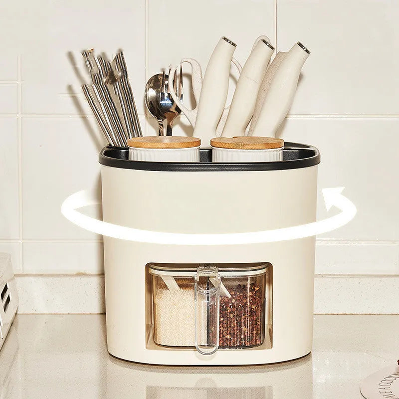 White rotating kitchen storage bucket with utensils next to a four-compartment spice box on a countertop.
