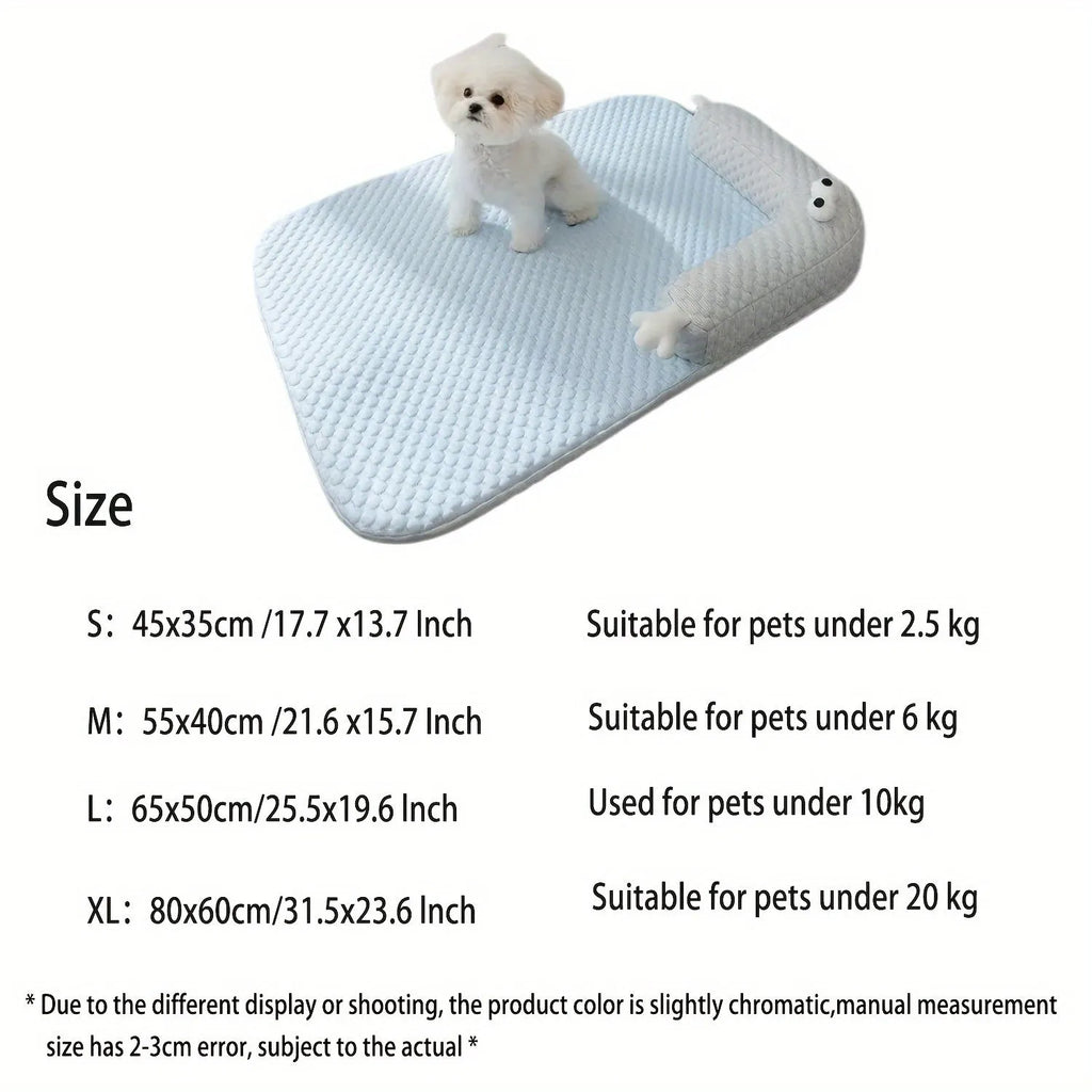 Blue pet bed cushion with big-eyed monster design on a wooden floor.