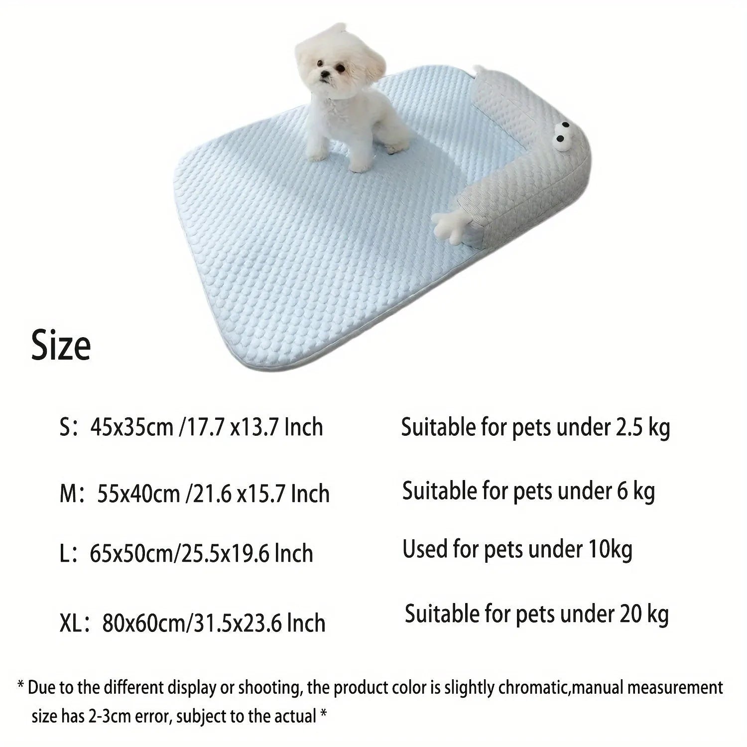 Blue pet bed cushion with big-eyed monster design on a wooden floor.
