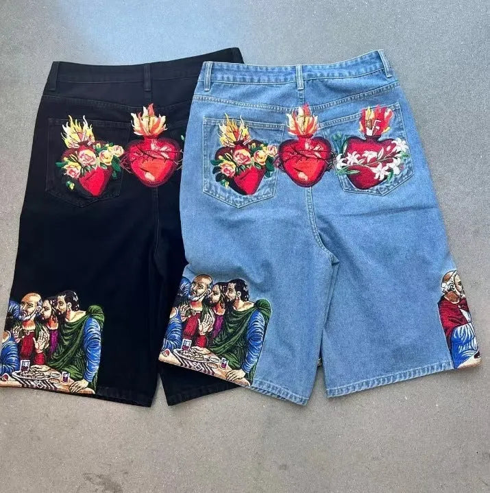 Blue men's cotton shorts with a Jesus design on the back pocket, showing tapered leg.