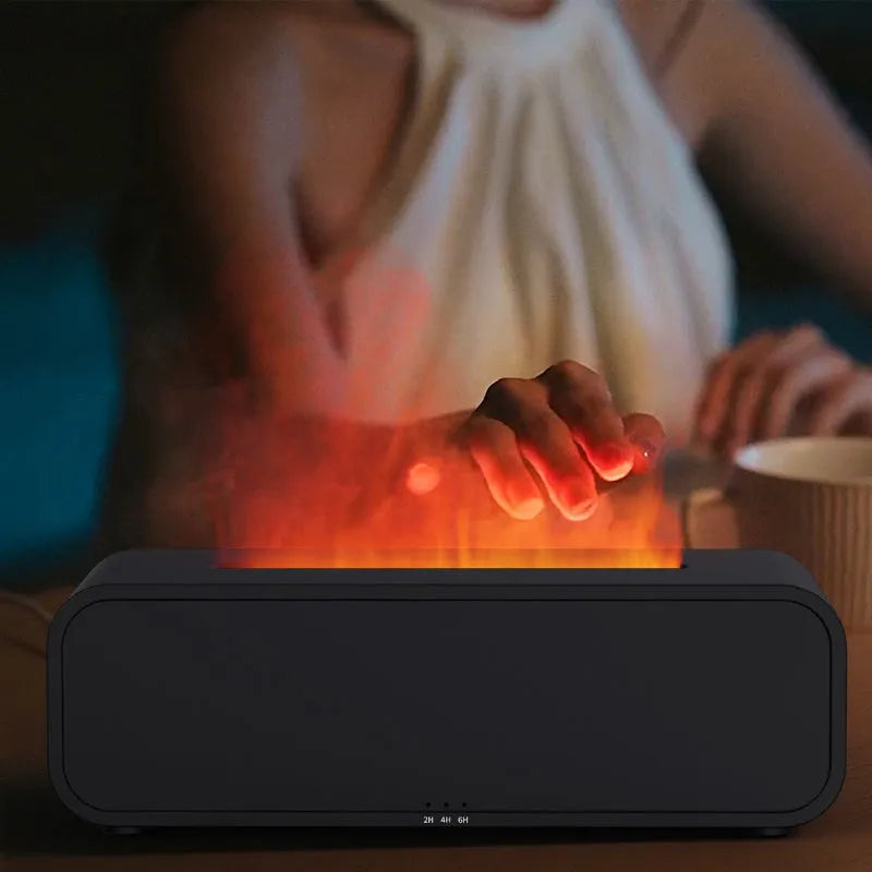 Black and white USB essential oil aroma diffuser with remote control and colour-changing flame light.