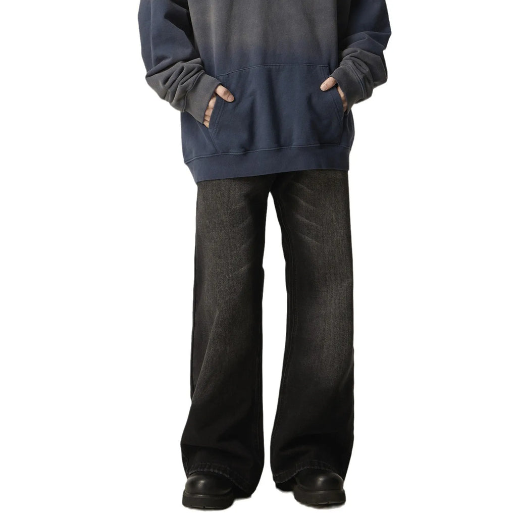 Black loose straight jeans with zipper fly on mannequin showing relaxed fit through leg