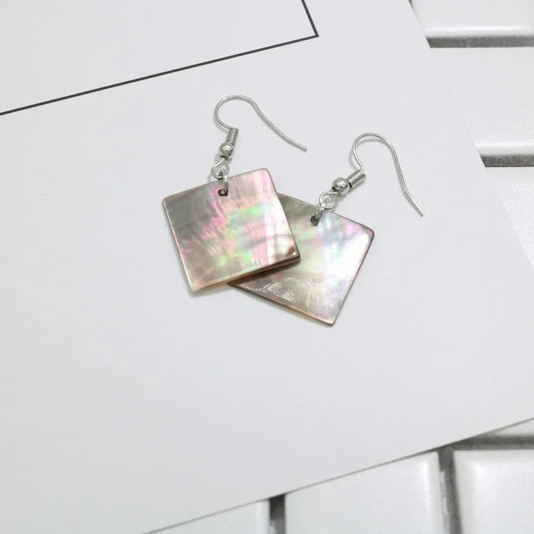 Women's geometric shell earrings in square and rectangular designs with natural shell material texture