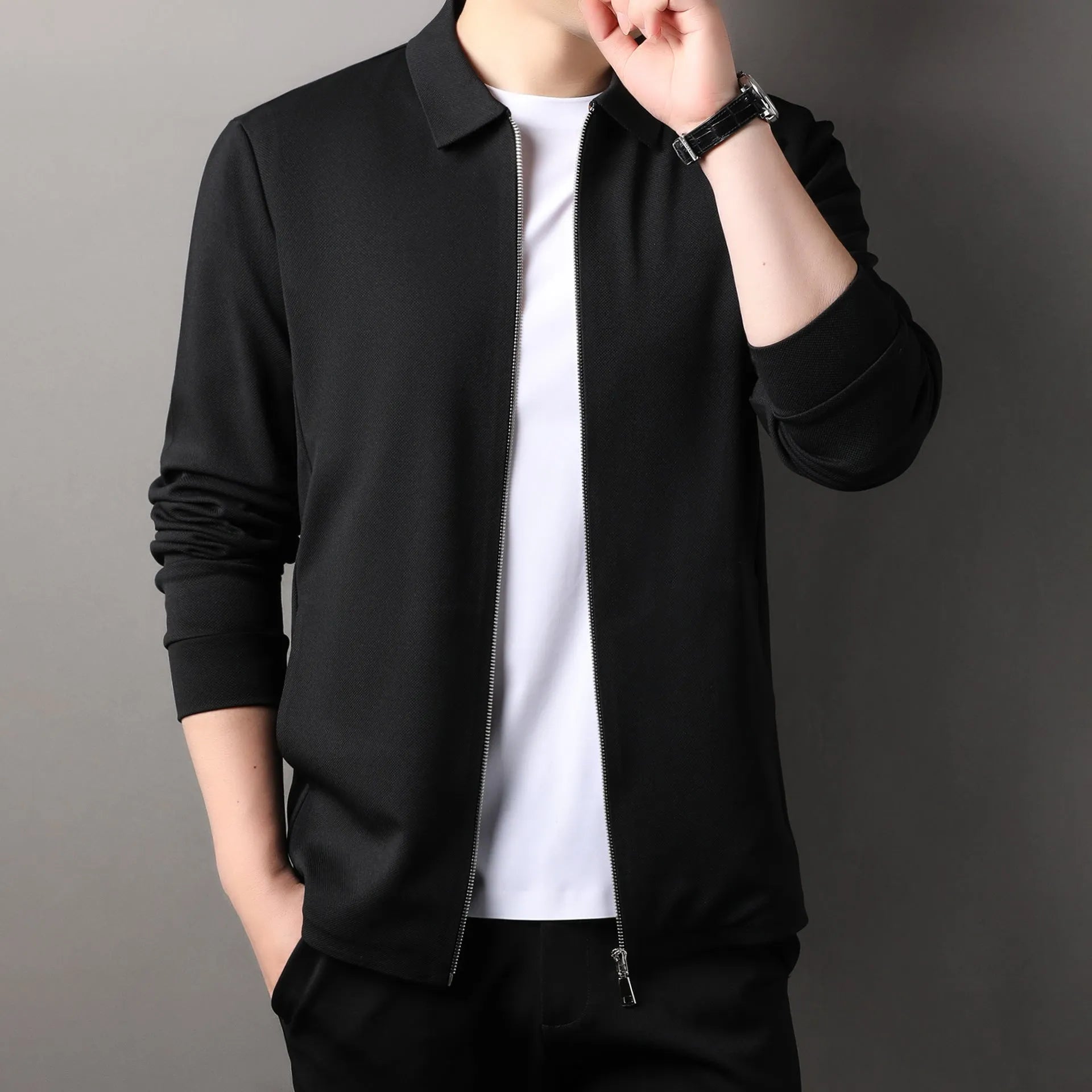 Men's jacket in apricot colour with straight hem and long sleeves, made from polyester fibre, shown on a hanger.