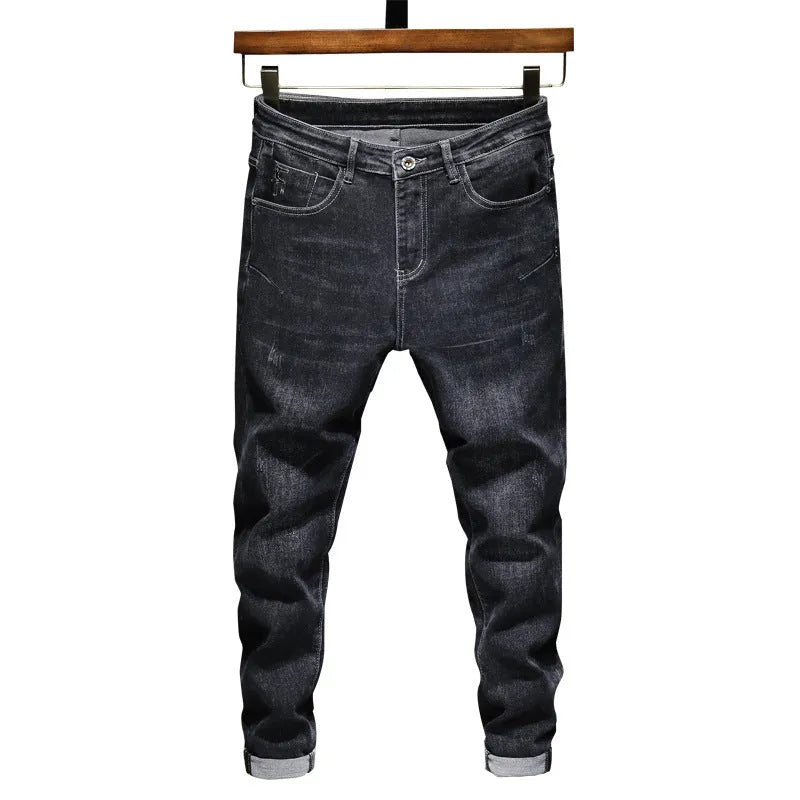 Men's dark grey loose straight-leg cotton denim jeans with mid waist, zip fly and cat whisker finish