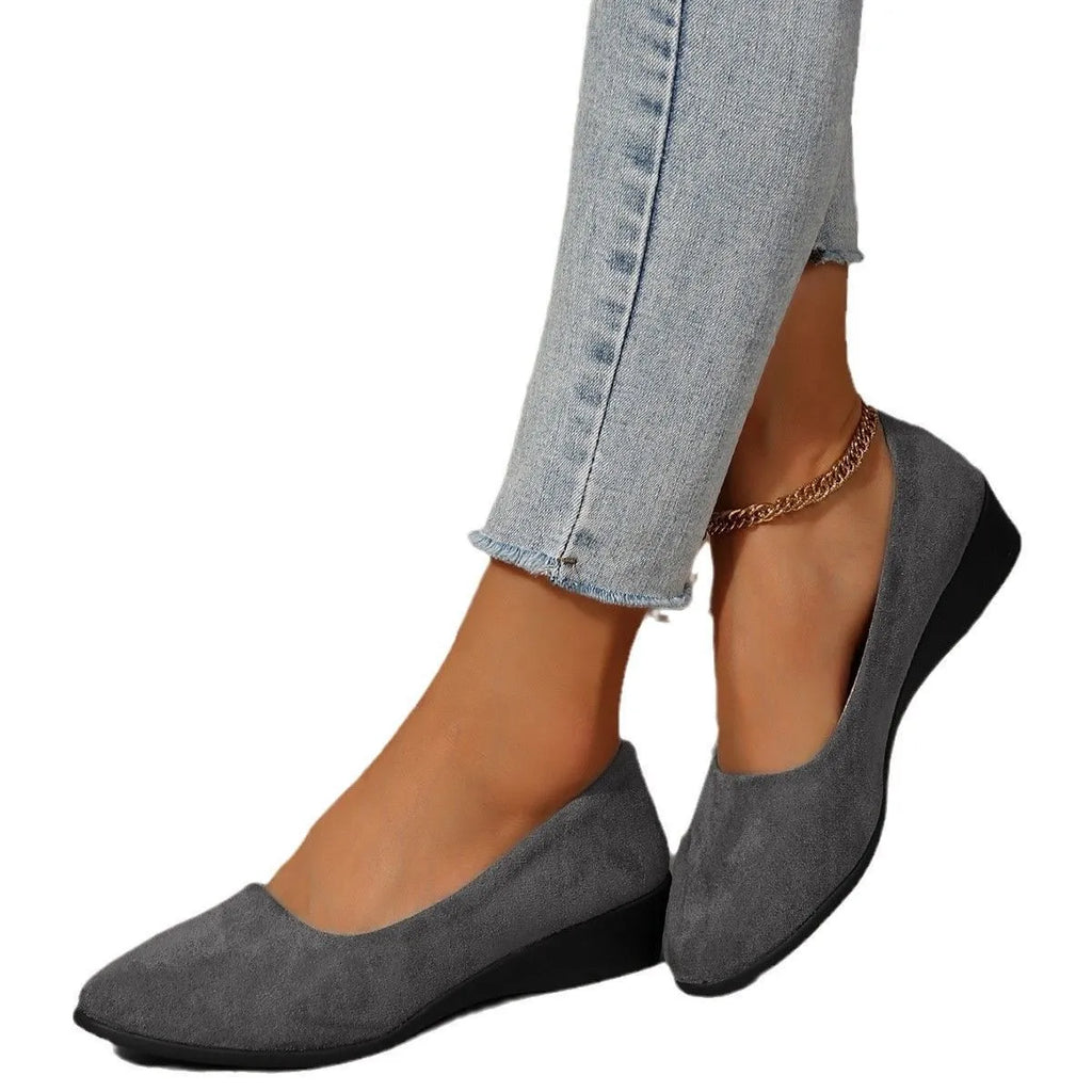 Women's plus size pointed toe wedge pumps with suede upper and low heel in black, blue, gray, khaki, or light brown.
