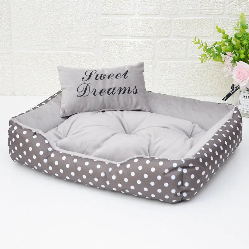Polka dot print square dog bed with a matching embroidered pillow in grey.