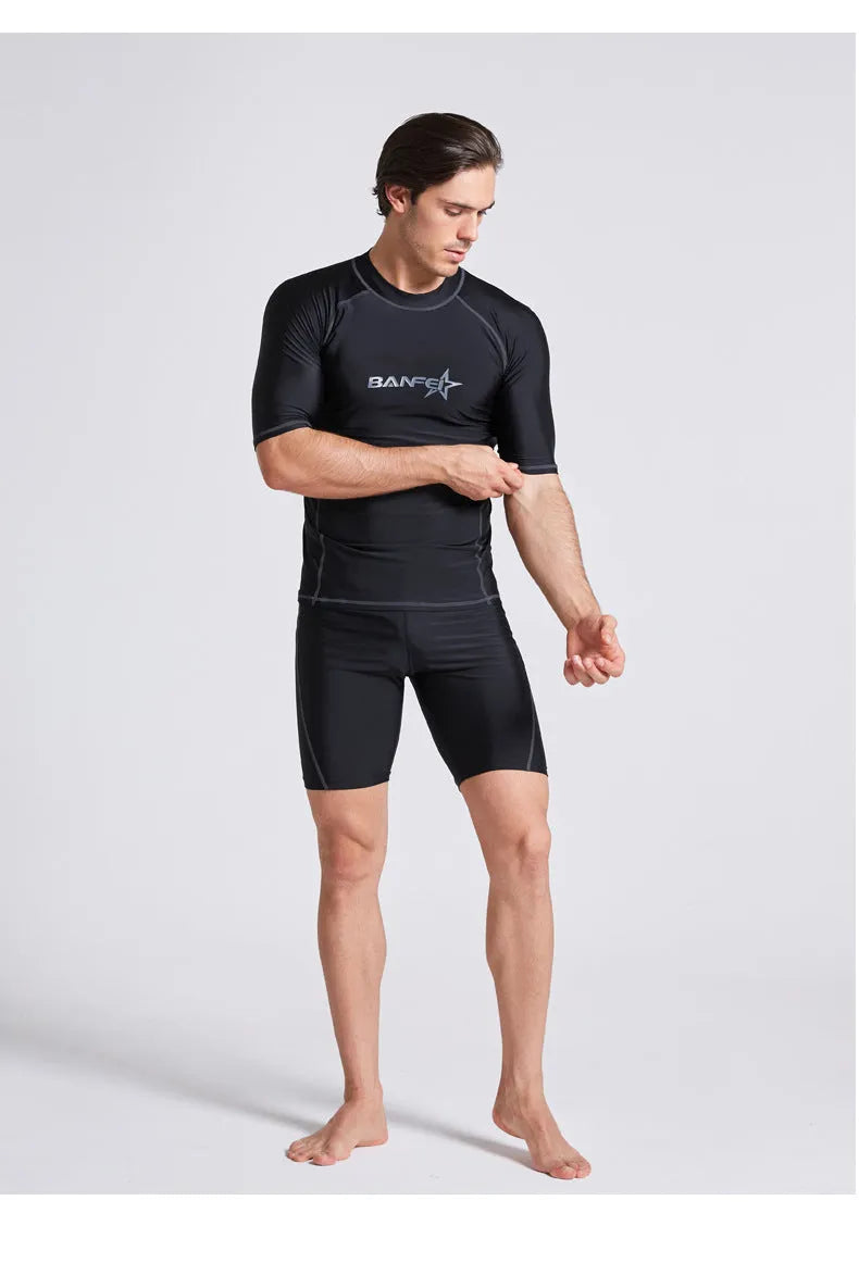 Men's blue quick-dry nylon two-piece swim set with half-sleeve top and swim pants laid flat