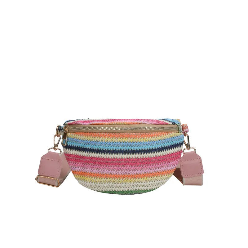 Blue straw woven women's shoulder bag with shell shape and single strap showing sandwich pocket detail