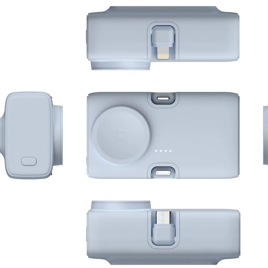 Compact white plastic wireless power bank with 5000mAh capacity, shown next to a smartphone.