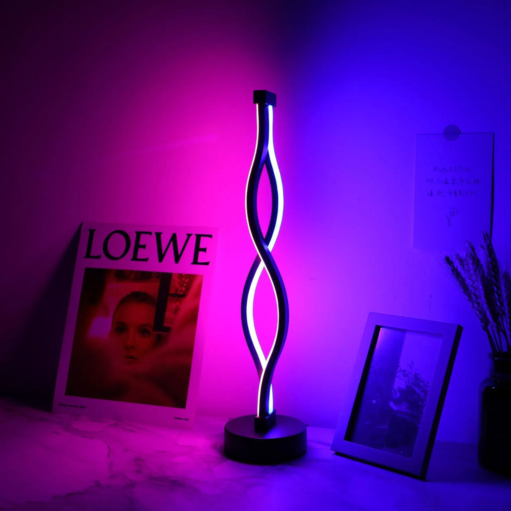 Black aluminium desk lamp with three-colour dimming button on desktop