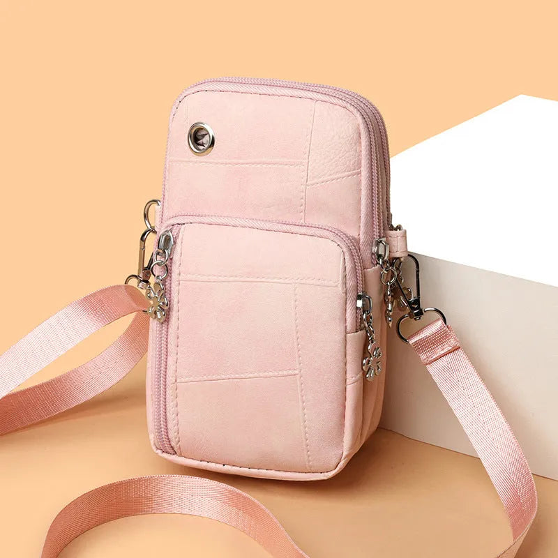 Mini vertical phone crossbody bag in PU leather with sandwich pockets, shown in available colours