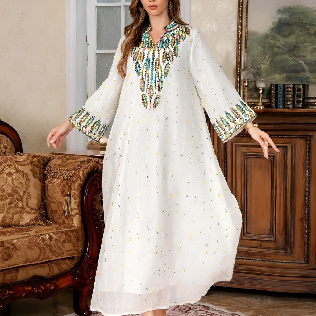 White long sleeve Arabic robe abaya with long skirt on a hanger