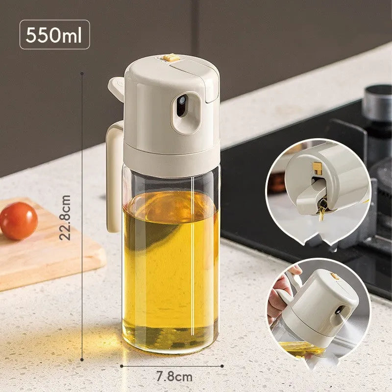 Warm grey glass 2-in-1 oil sprayer and pourer bottle with switchable cap on kitchen counter