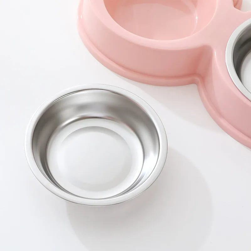 Stainless steel pet feeding bowl with two sections for food and water, in blue colour, measuring 30cm long