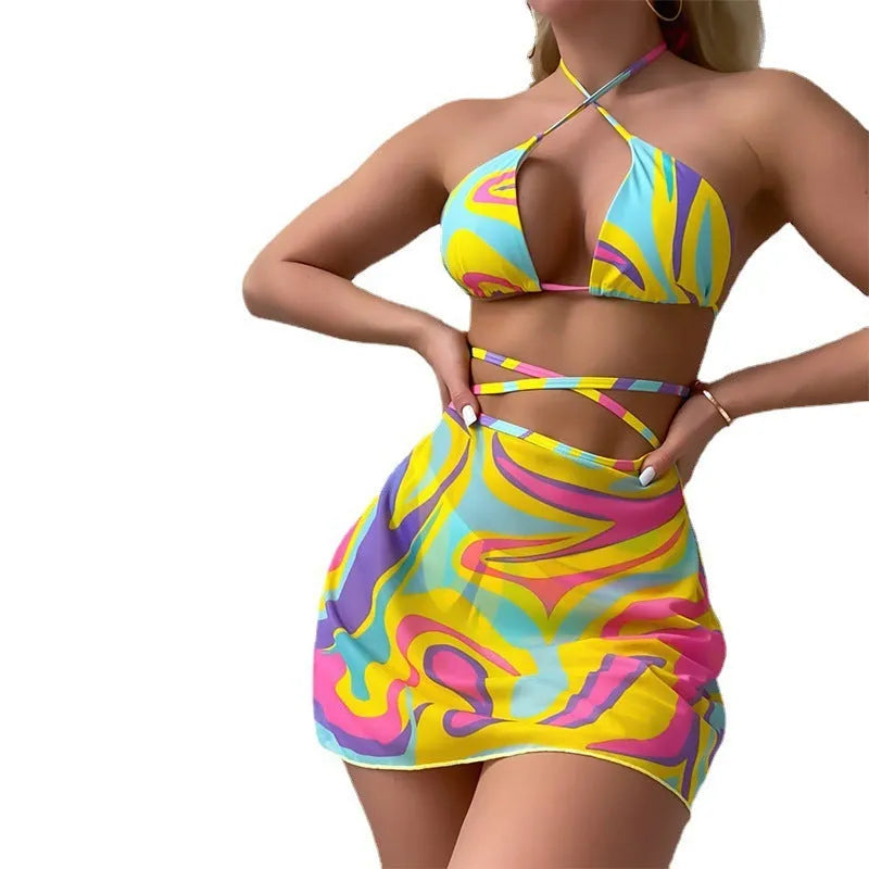 Yellow striped halter-neck swimsuit with lace-up front, matching skirt, and shorts