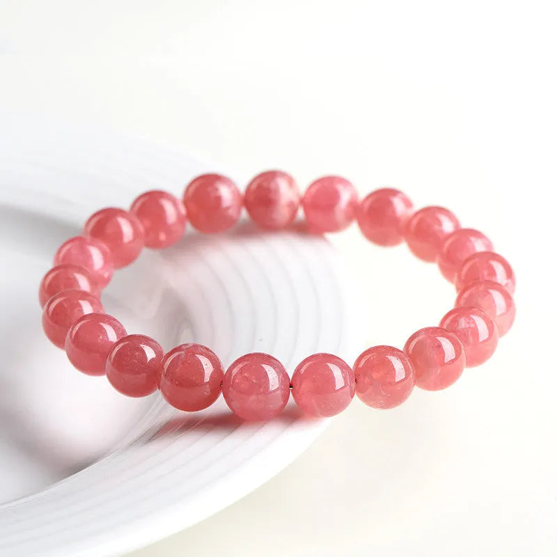 Women's natural red rhodochrosite crystal bracelet with geometric design and longevity lock fastening