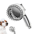 Silver dog shower attachment with silicone comb teeth and ergonomic grip for bath time