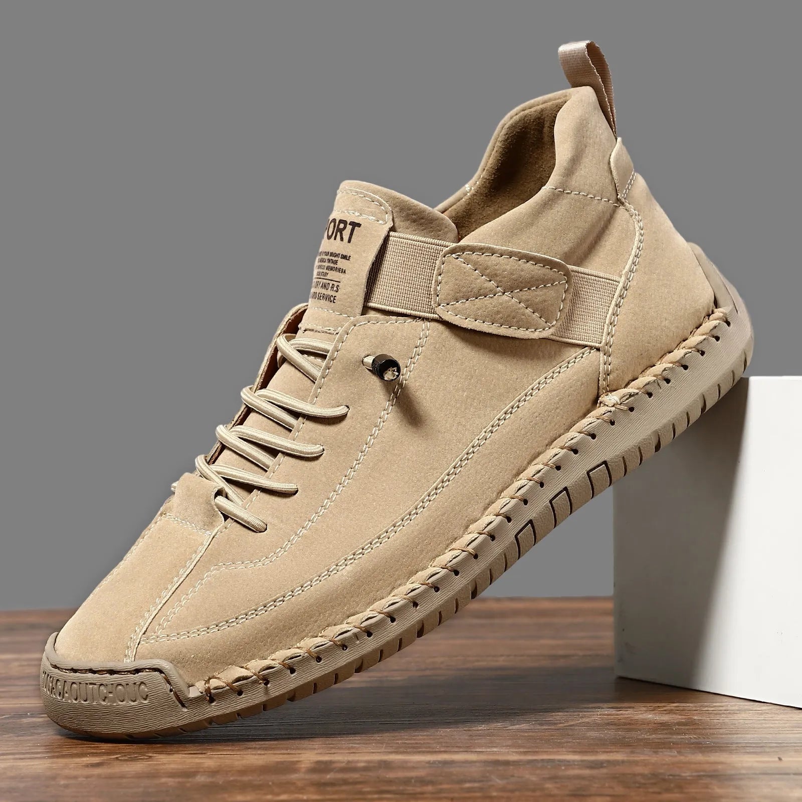 Men's mid-top Martin boots with elastic band closure in khaki colour, showing round toe and mid-calf design